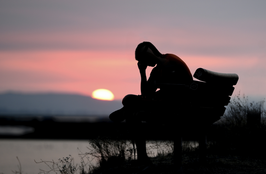 Man sitting on a chair thinking